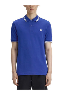 Royal blue Fred Perry men’s polo shirt with white trim and embroidered laurel wreath logo on chest