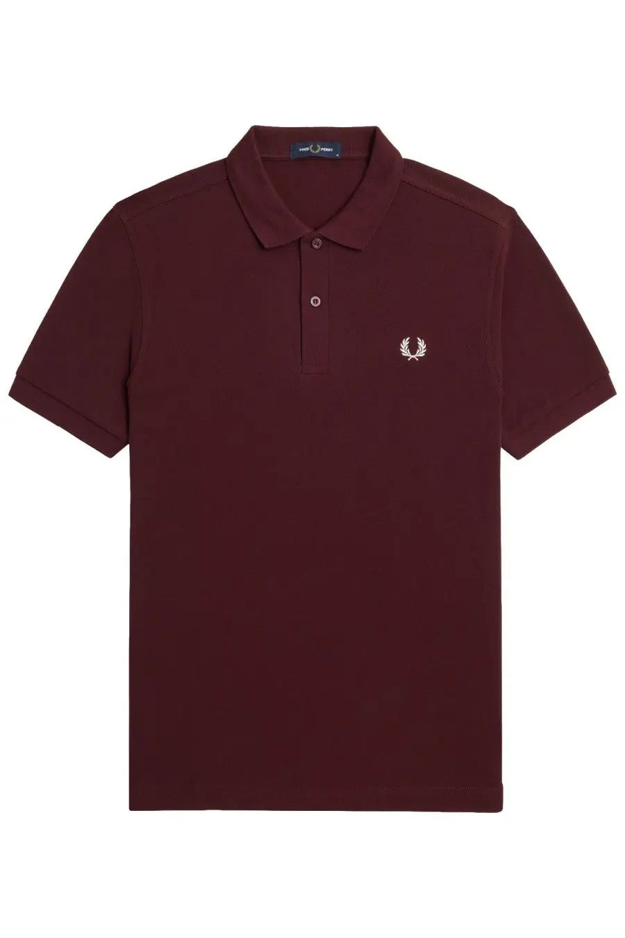Fred Perry men’s red polo shirt with white embroidered laurel wreath logo and navy blue brand tag at the collar