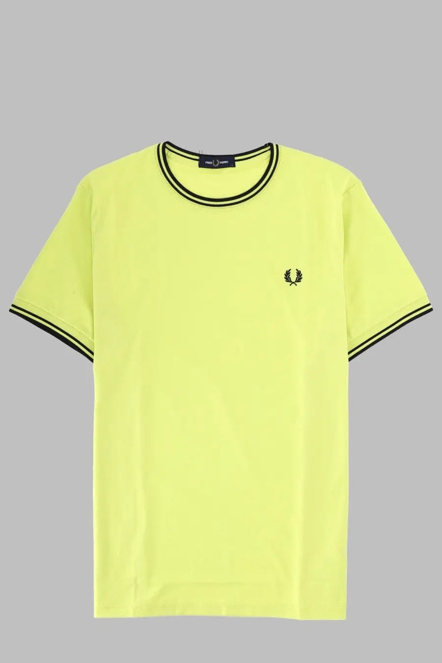 A neon yellow fred perry men’s shirt with black trim and small embroidered logo on the chest