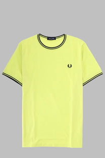 A neon yellow fred perry men’s shirt with black trim and small embroidered logo on the chest