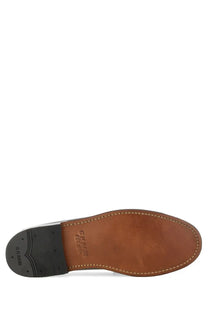 Brown leather sole of gh bass men’s mocassino weejun heritage larson black shoe with visible stitching and black rubber outsole