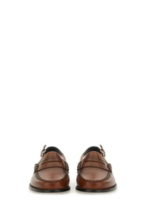 Brown leather loafers with classic moccasin design and black rubber soles from gh bass women’s moccasin weejun beige