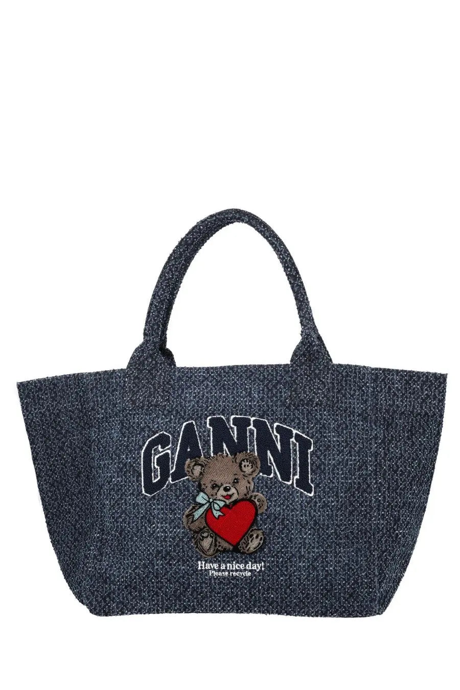 Ganni women’s medium trapeze tote bag in blue denim featuring an embroidered teddy bear holding a red heart and brand name