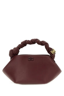 A burgundy leather handbag with braided handle and gold-tone hardware from ganni womens borsa bou mini red collection