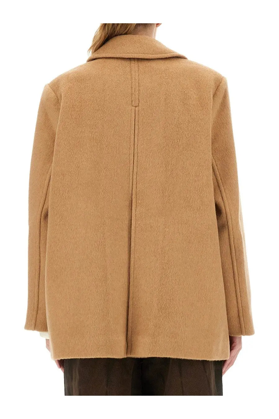 Camel colored oversized wool coat with structured collar and straight back seam shown from the back side