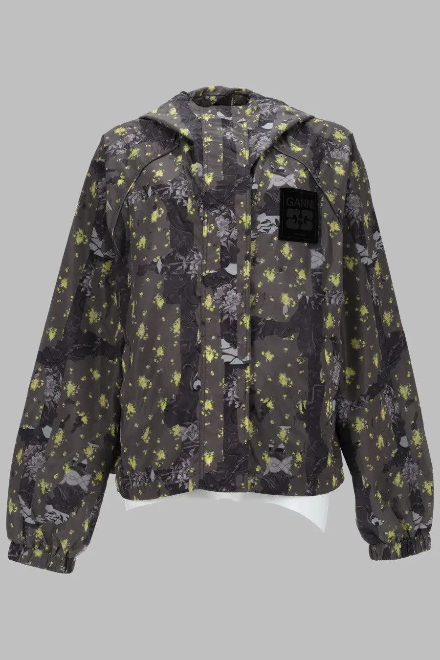 Dark olive green ganni hooded jacket in lightweight nylon with vibrant yellow and black floral pattern
