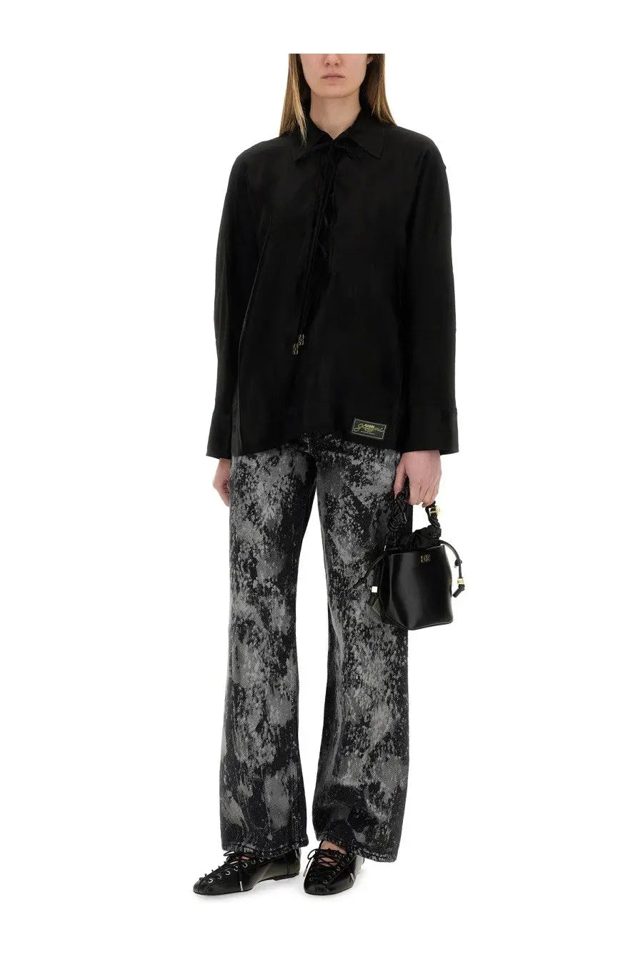 Black leather bucket bag with gold-tone hardware and drawstring top paired with ganni women’s jacquard satin shirt black