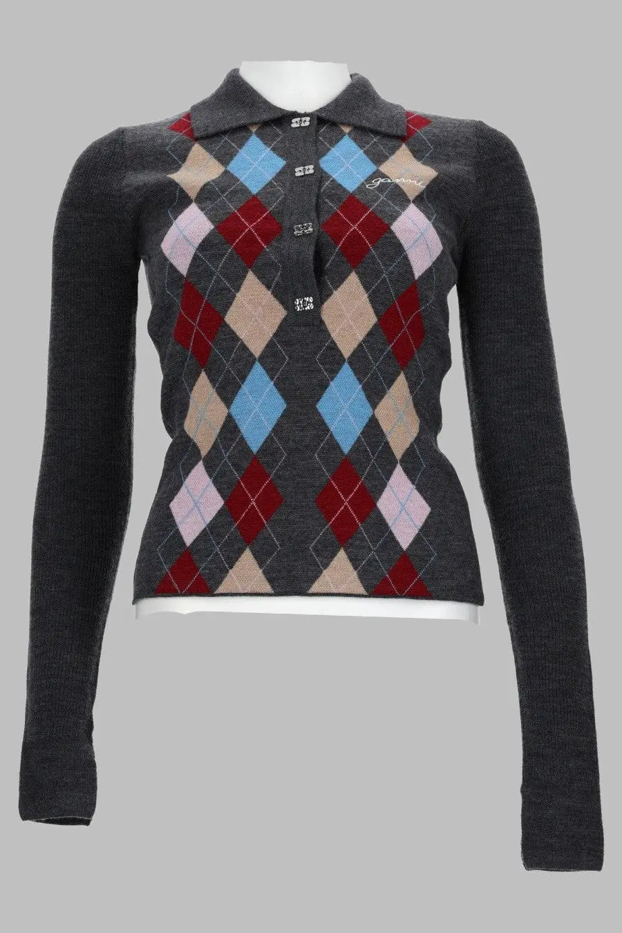 Dark gray argyle knit sweater with collar button closure featuring diamond patterns in red light blue beige and pale pink
