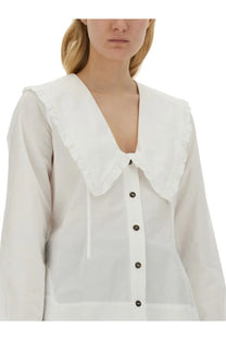 White blouse by Ganni with a peter pan collar ruffled neckline and black buttons perfect for women’s fashion