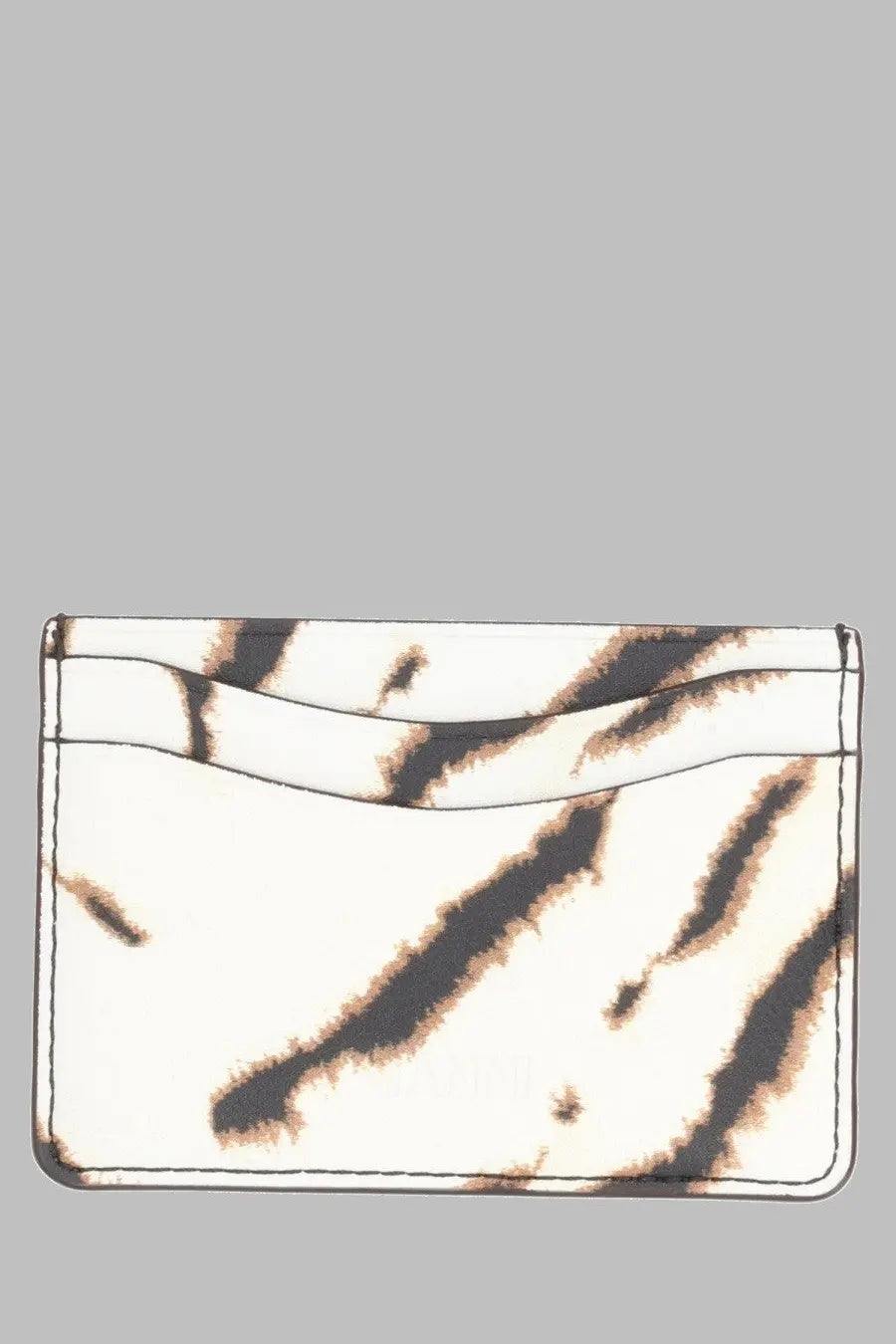 A sleek white Ganni women’s portacarte bou pattern card holder with bold irregular black tiger stripe patterns