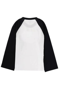 Ganni women’s shirt white with black and white raglan sleeves featuring a minimalist design front view