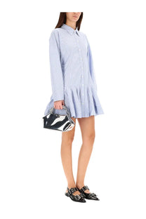 A sleek glossy black and silver handbag with chain strap paired with ganni women’s striped blue chemisier dress