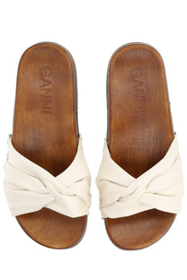 Cream-colored knotted leather slide sandals with wooden sole and ganni embossed insole from ganni women’s zoccolo tia fairy white