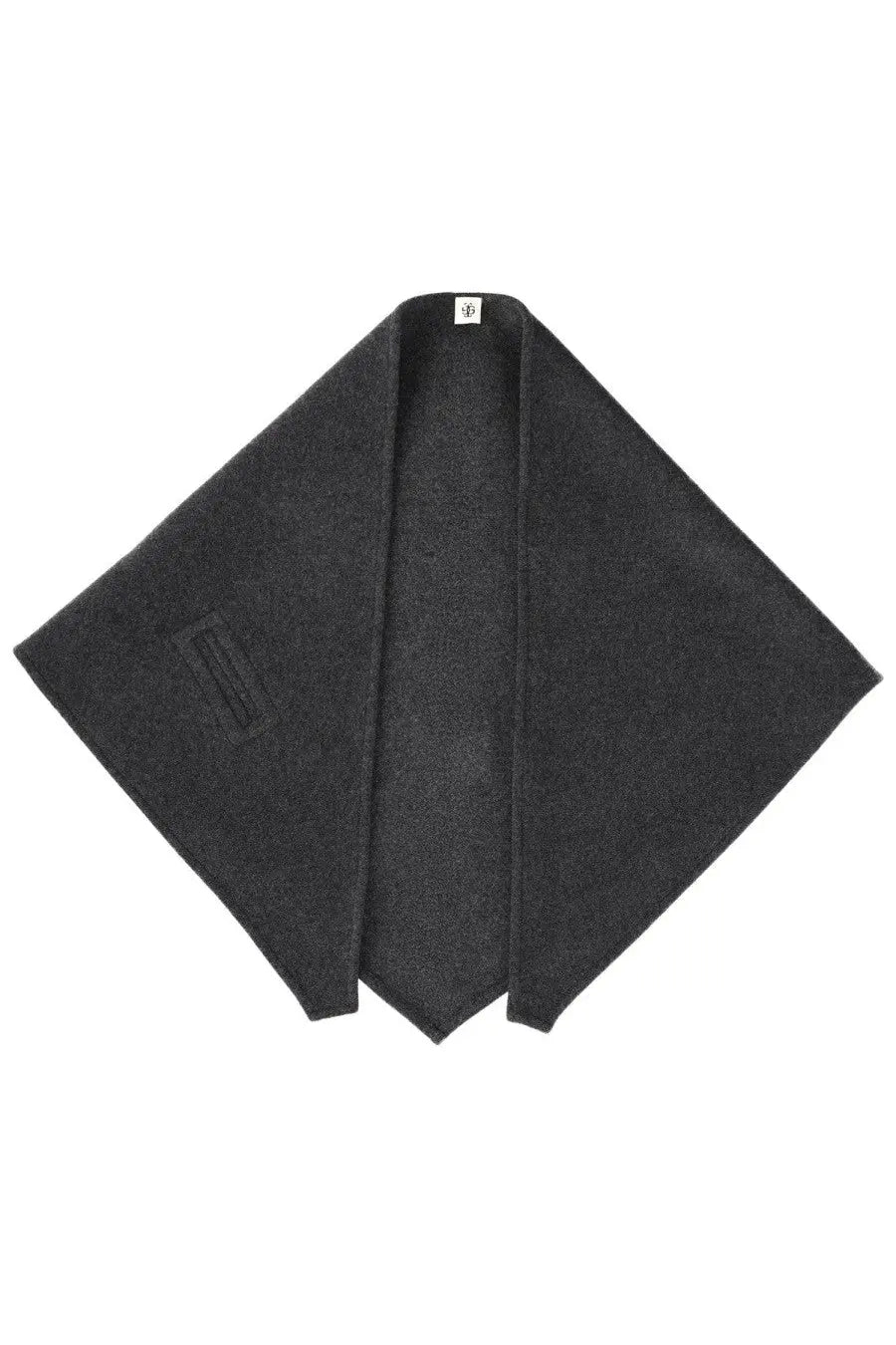 The garment women’s clooney scarf grey shown with a black woolen poncho featuring a subtle textured weave and minimalist branding