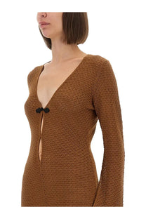 The garment women’s long dress Tanzania bronze in brown textured knit with long sleeves and deep v-neck black bow accents