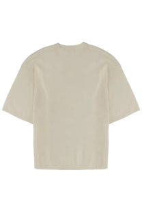 Cream-colored oversized short-sleeved t-shirt with relaxed fit and crew neckline from the garment women shirt como beige