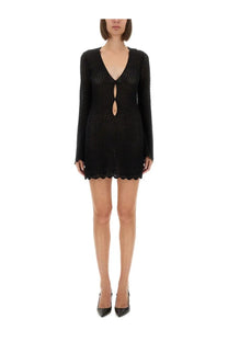 The garment women’s black knitted mini dress with scalloped hem and long sleeves in tanzania style