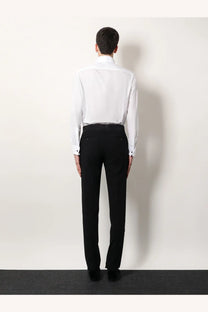 Black tailored trousers with a sleek formal cut and subtle creases paired with giorgio armani men’s white cotton shirt