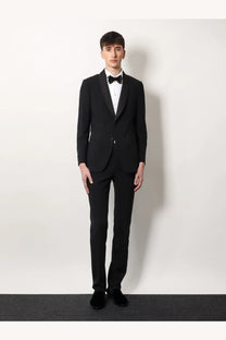 Black tuxedo suit with satin lapels and matching bow tie styled with a Giorgio Armani men’s white cotton shirt