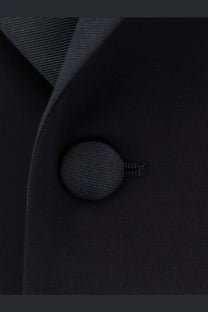 Black textured fabric button with subtle ribbed pattern on Giorgio Armani men’s virgin wool tuxedo blue