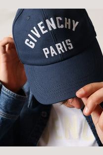 Navy blue Givenchy Paris men’s cotton baseball hat with white embroidered lettering on the front