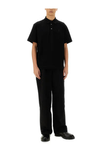 Givenchy men’s black cotton polo shirt with short sleeves and a subtle chest logo for casual wear