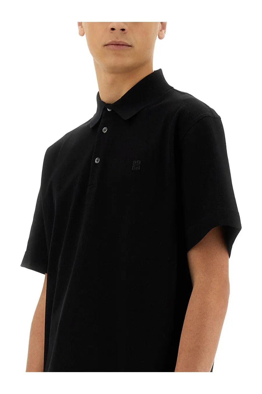 Givenchy men’s black cotton polo shirt with short sleeves and a subtle embroidered logo on the chest