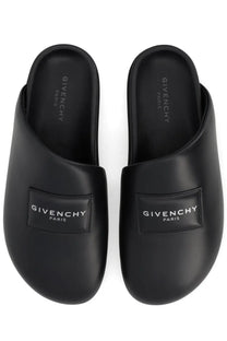 Black Givenchy Paris men’s mule puffy slip-on sandals with sleek minimalist design and embossed logo patches