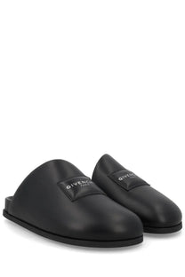 Givenchy men’s mule puffy black slip-on slippers with sleek glossy leather finish and minimalist branding patch