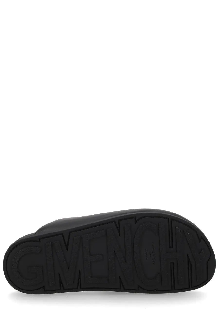 Black rubber sole with embossed Givenchy logo on the back of Givenchy men’s mule puffy black slippers