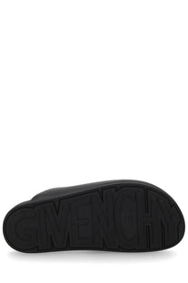 Black rubber sole with embossed Givenchy logo on the back of Givenchy men’s mule puffy black slippers