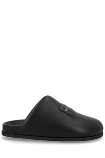 Black Givenchy men’s mule puffy slide sandal with sleek minimalist design and subtle brand patch on the vamp