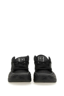 Givenchy men’s skate sneaker black with chunky sole textured upper and contrasting silver logo patch at the heel back view
