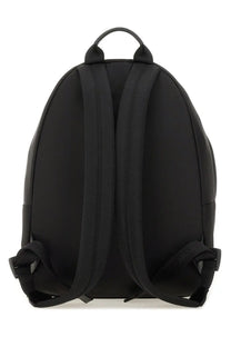 Givenchy men’s zaino essential black nylon backpack with adjustable shoulder straps and top handle shown from the back side
