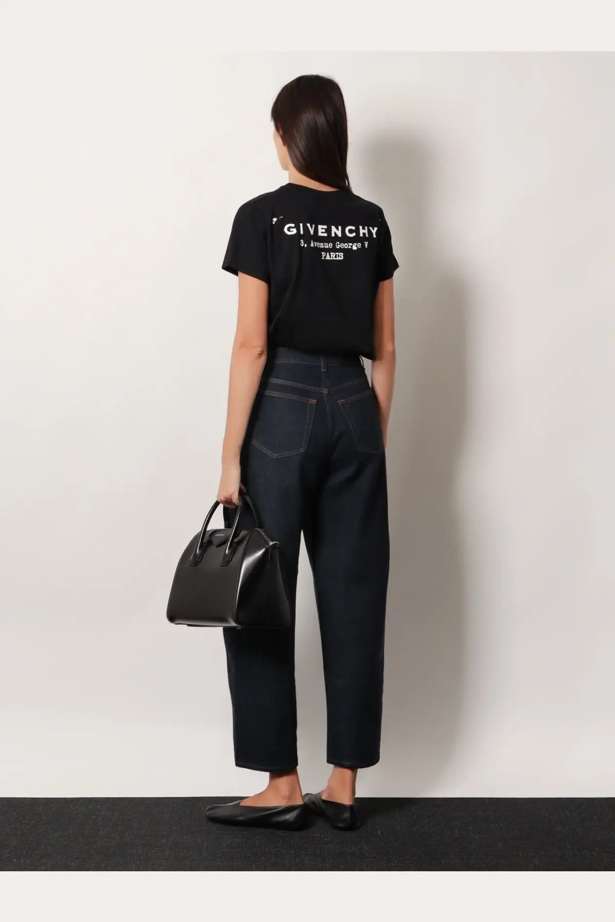 Black Givenchy tote bag with structured design and top handles shown alongside Givenchy women’s cotton shirt black