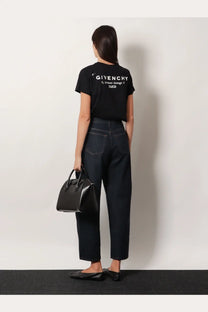 Black Givenchy tote bag with structured design and top handles shown alongside Givenchy women’s cotton shirt black