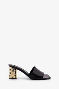Givenchy women’s black leather mule sandal with gold foiled block heel featuring embossed lettering