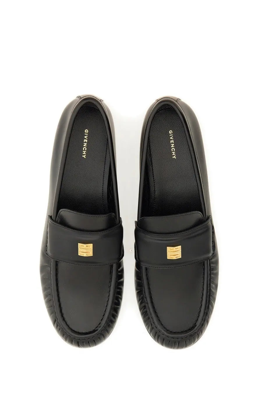 Givenchy women’s black leather moccasin loafers with gold-tone logo accents for stylish everyday wear