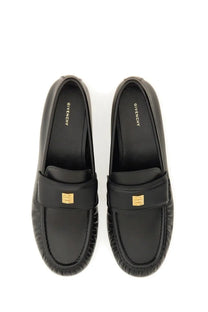 Givenchy women’s black leather moccasin loafers with gold-tone logo accents for stylish everyday wear