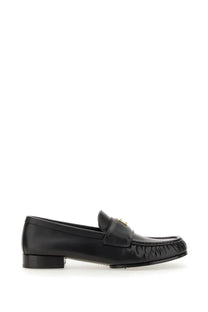 Givenchy women’s moccasin black leather loafer with gold-tone logo on strap for stylish everyday wear