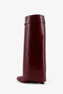 Givenchy women’s shark leather boots in burgundy with gold-tone buckle detail showcasing luxury design