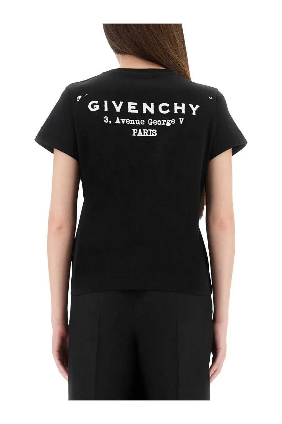 Black givenchy women’s shirt showing back with white embroidered logo and address text on cotton fabric