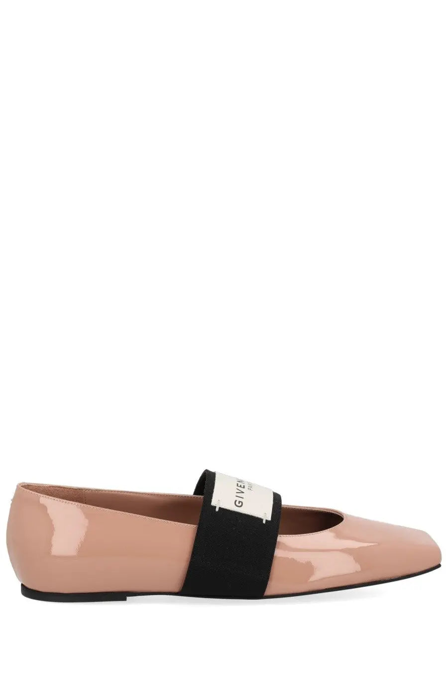 A sleek nude patent leather flat shoe with black elastic strap and white Givenchy logo tag for women