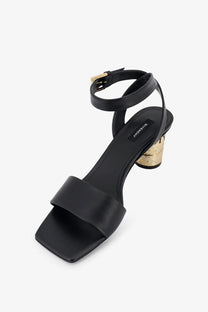 Givenchy women’s black leather tape heeled sandals with gold-toned block heel and ankle strap