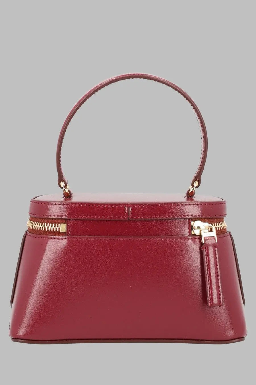 A sleek glossy burgundy leather Givenchy women’s Vanity Antigona handbag with gold zippers and curved top handle