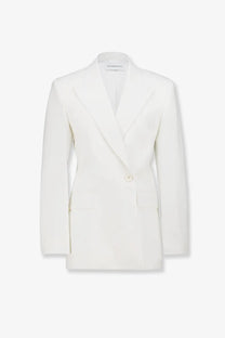 A crisp white Givenchy women’s wool and mohair double-breasted blazer with classic tailored lines
