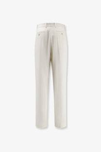 Cream-colored tailored givenchy wool and mohair trousers with a sleek straight-leg cut and subtle back pleats shown from the back