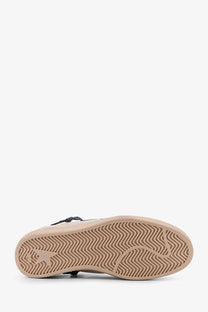 Beige rubber sole with wavy tread and small embossed logo on golden goose men’s ballstar leather and suede white sneaker