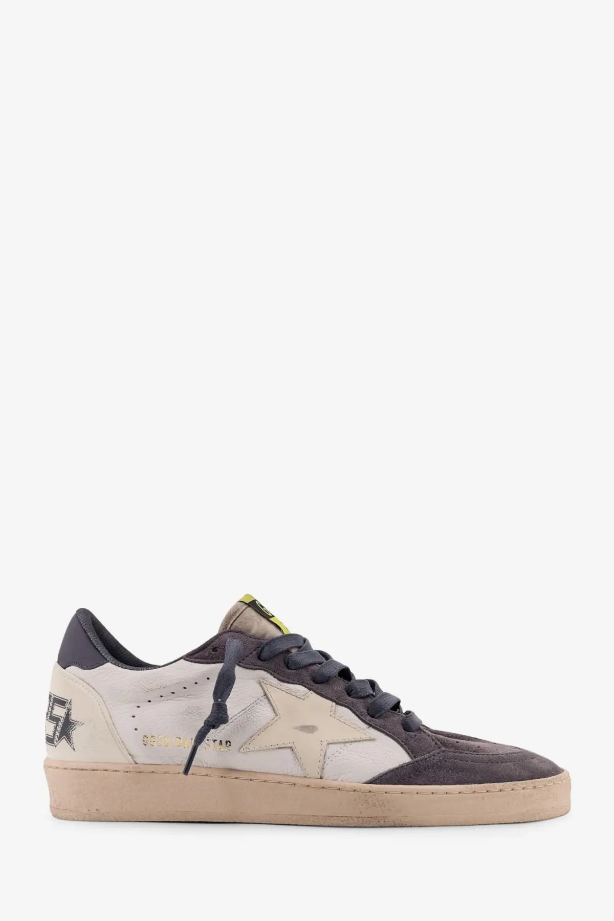 Golden Goose men’s Ballstar low-top sneaker in gray and off-white suede with star design, dark gray laces, and beige sole
