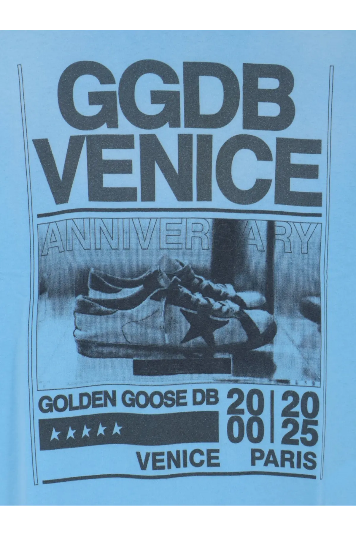 A pair of white leather sneakers with a black star logo classic laces and rubber sole styled with golden goose mens cotton shirt cristalseas